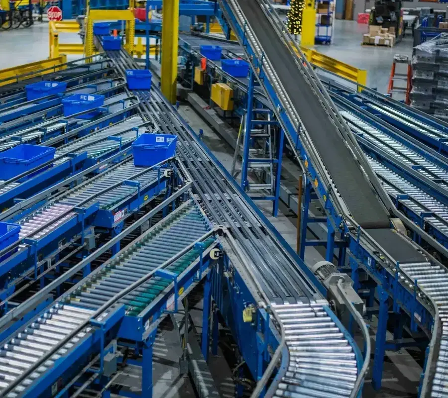 Industrial factory logistics aisle with machinery, pallets and material containers